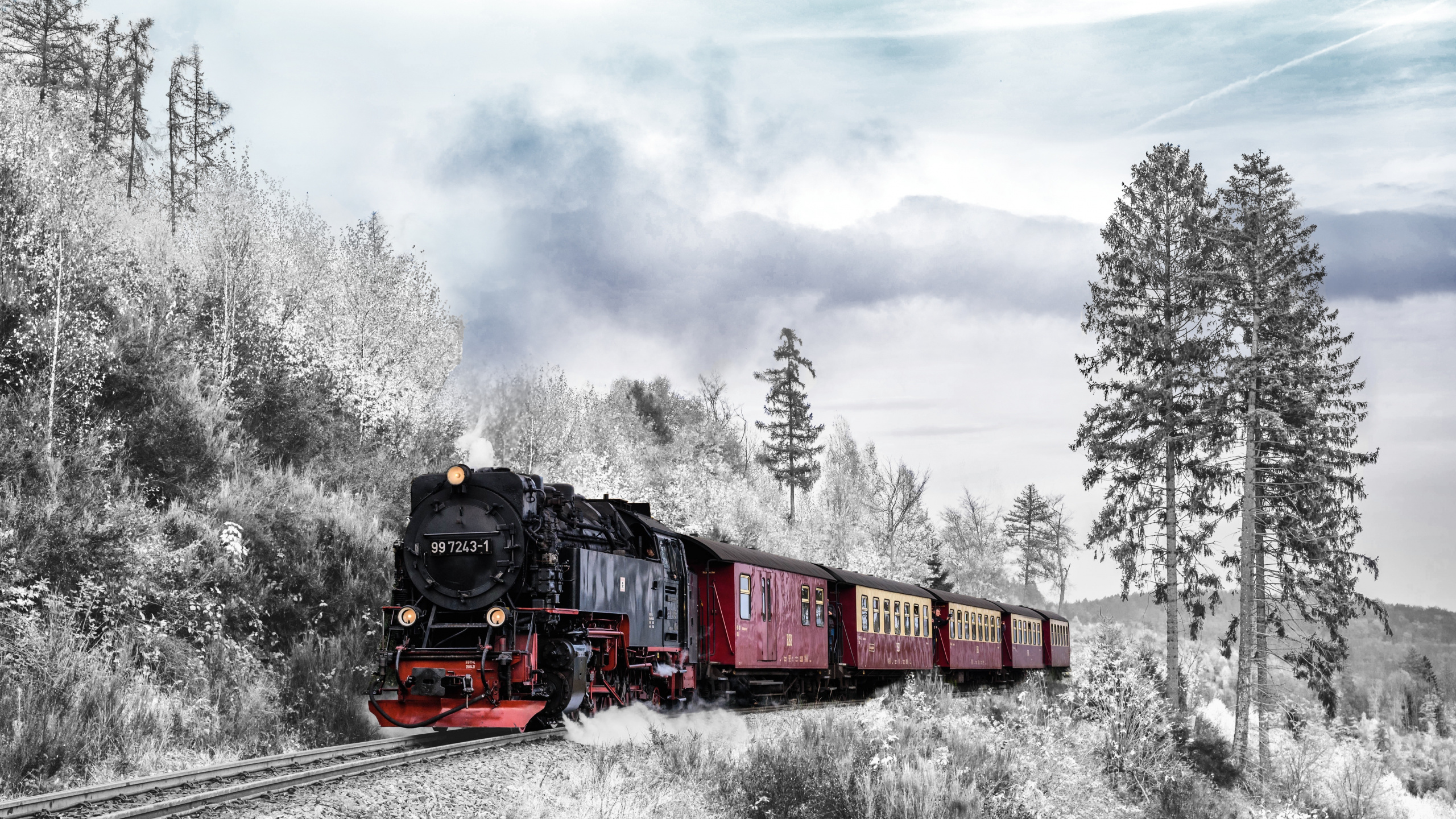 Red and Black Train on Rail Tracks Under Cloudy Sky. Wallpaper in 2560x1440 Resolution