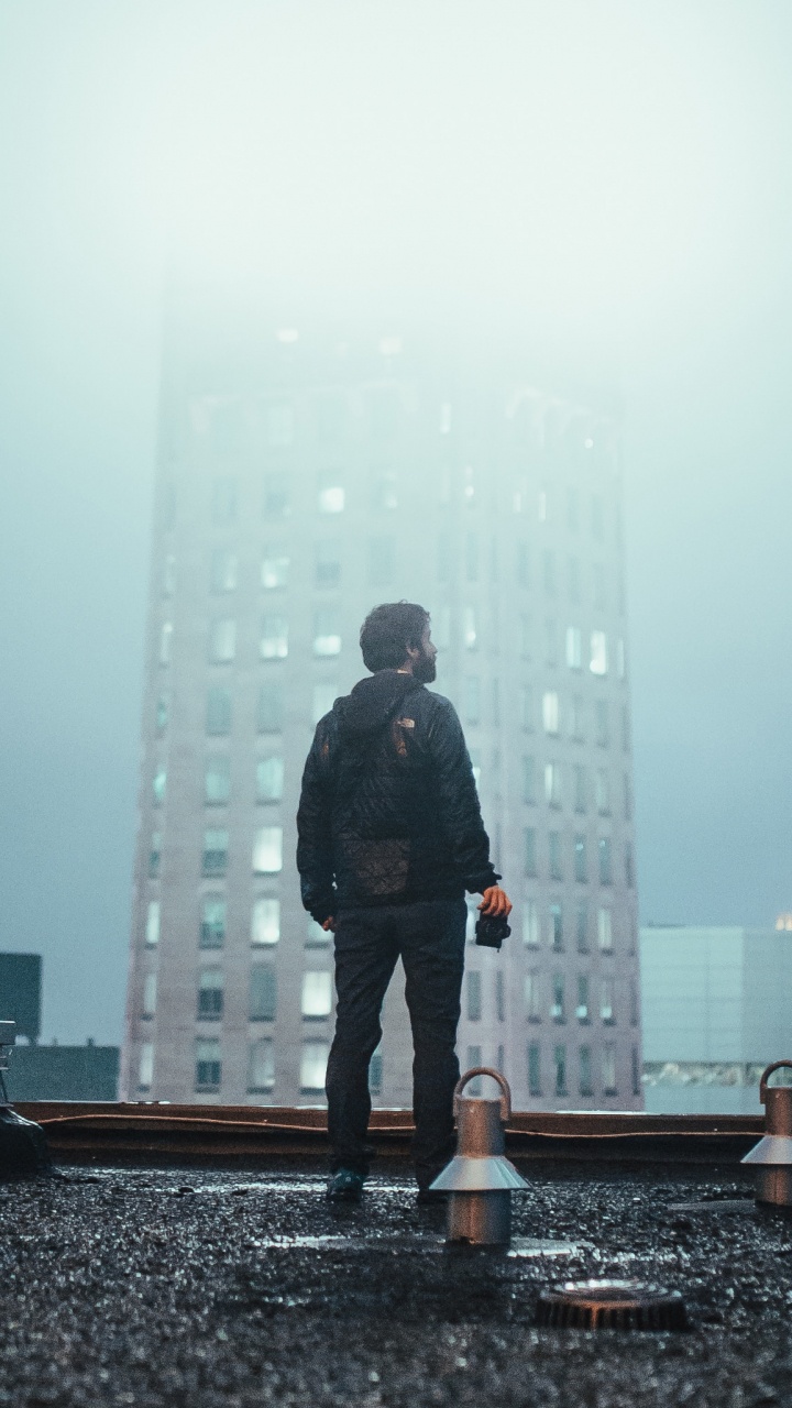 Man in Black Coat Standing on The Ground. Wallpaper in 720x1280 Resolution