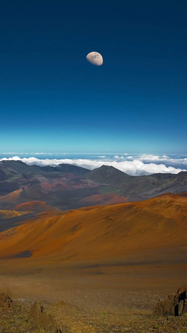 Brown and Green Mountains Under Blue Sky During Daytime. Wallpaper in 750x1334 Resolution