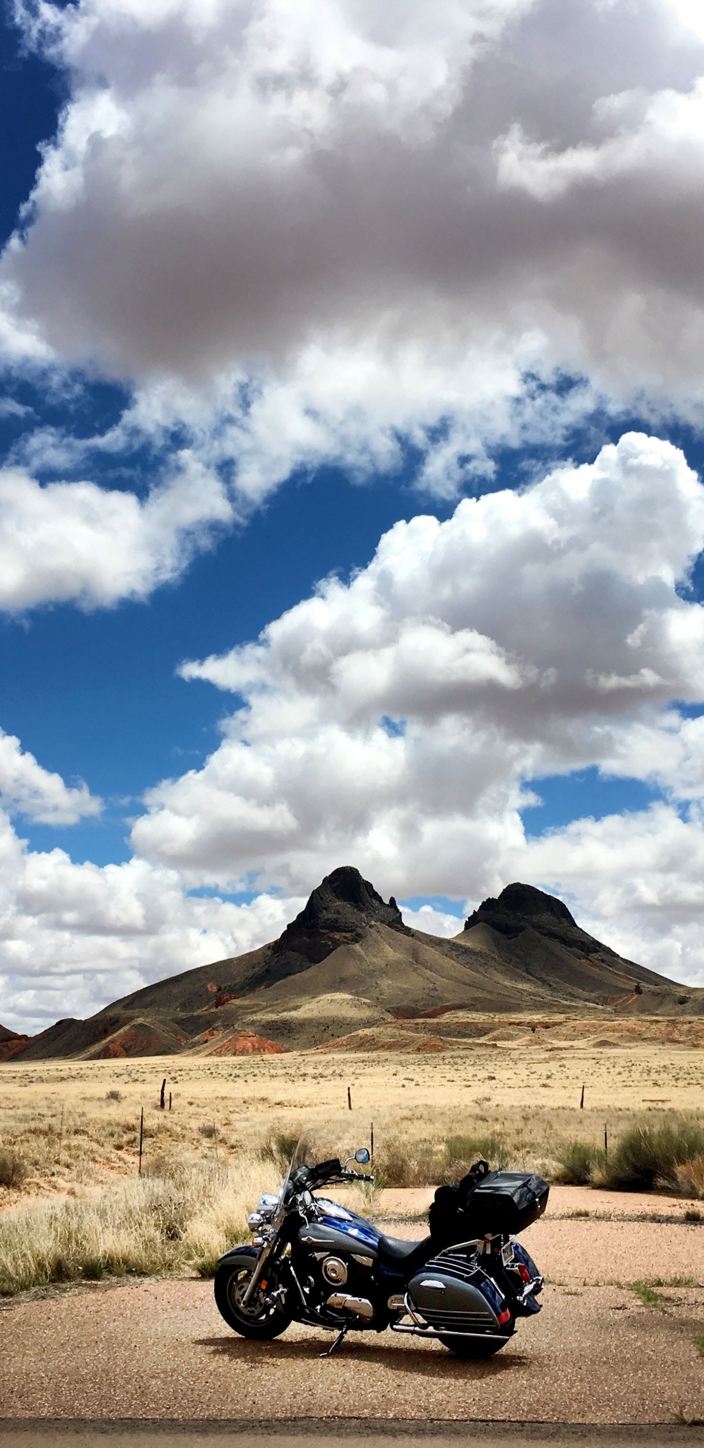 Black Motorcycle on Brown Field Under White Clouds and Blue Sky During Daytime. Wallpaper in 1440x2960 Resolution