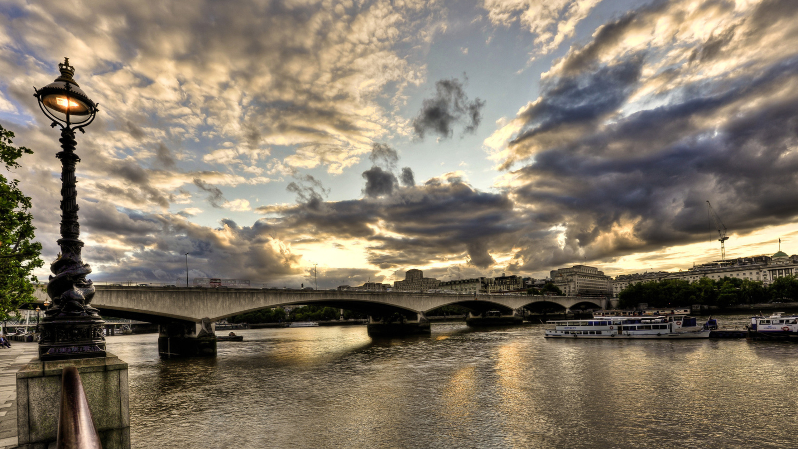 Gray Concrete Bridge Over River Under Blue Sky and White Clouds During Daytime. Wallpaper in 2560x1440 Resolution