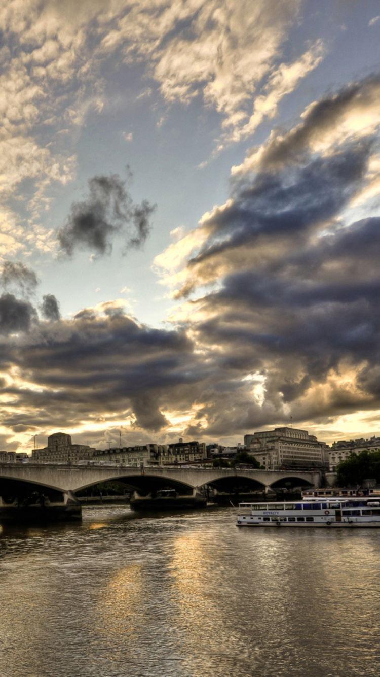 Gray Concrete Bridge Over River Under Blue Sky and White Clouds During Daytime. Wallpaper in 750x1334 Resolution