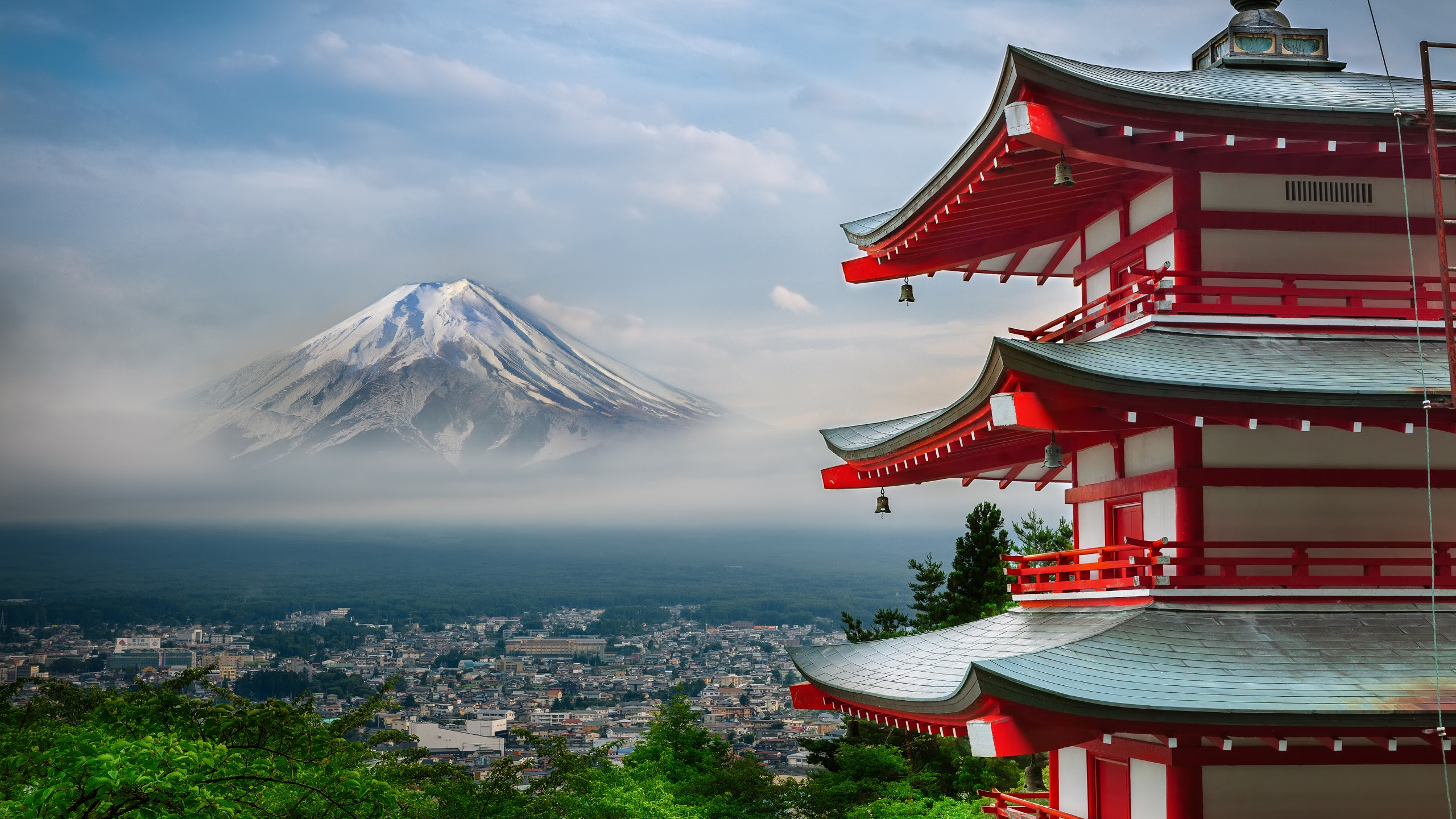 Red and White Temple Near Body of Water Under White Clouds During Daytime. Wallpaper in 2560x1440 Resolution