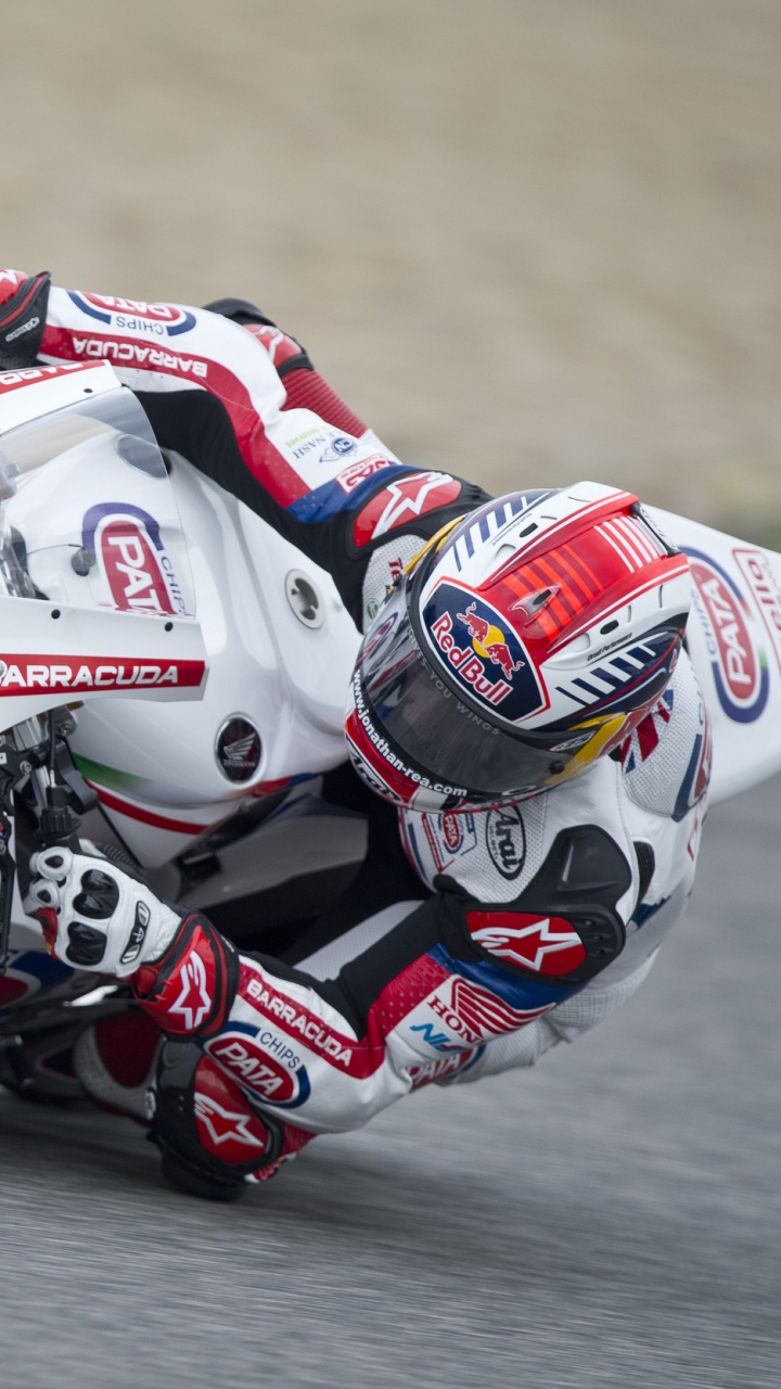 Man in Red and White Racing Suit Riding on Red and White Sports Bike. Wallpaper in 720x1280 Resolution