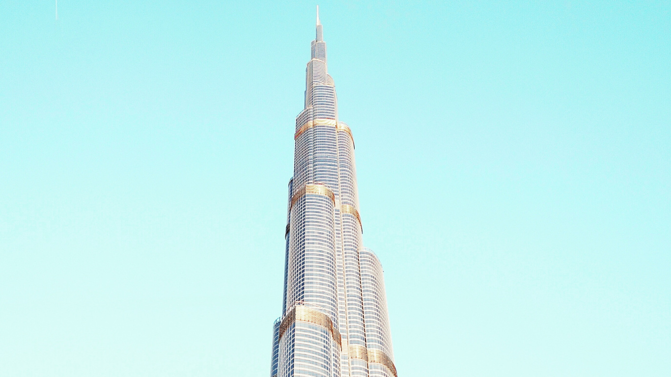 White and Black Concrete Building Under Blue Sky During Daytime. Wallpaper in 1366x768 Resolution