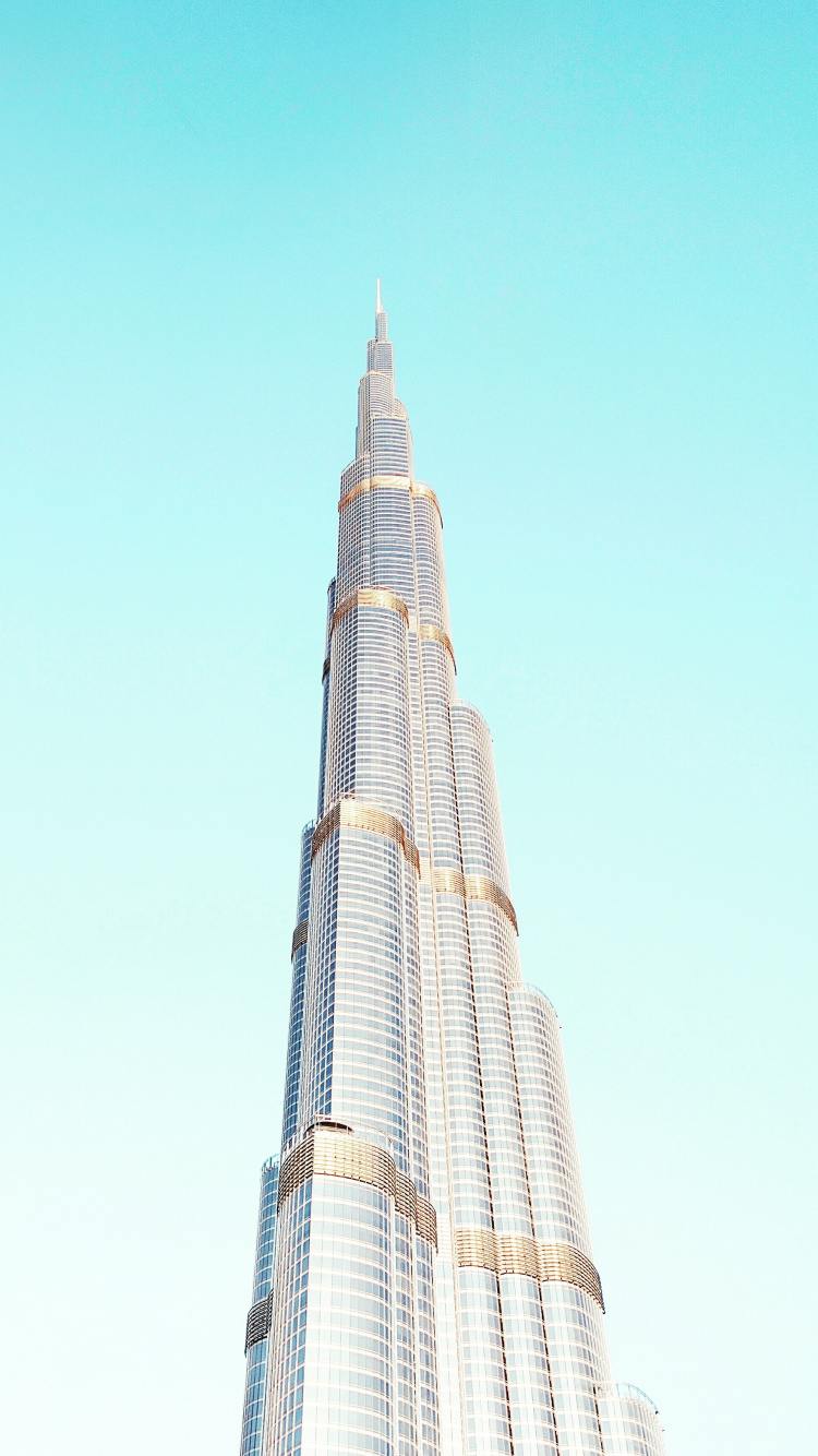 White and Black Concrete Building Under Blue Sky During Daytime. Wallpaper in 750x1334 Resolution