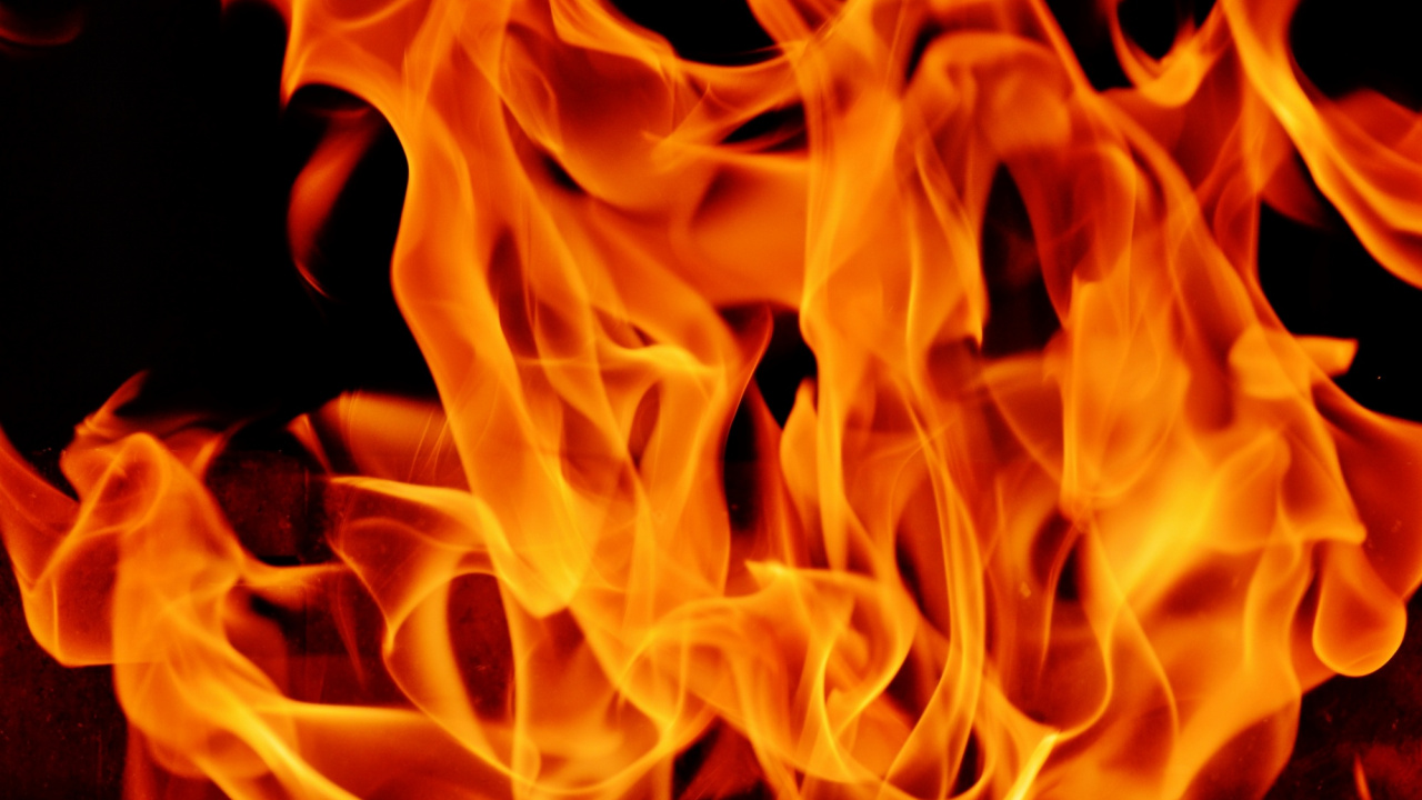 Orange Fire in Black Background. Wallpaper in 1280x720 Resolution