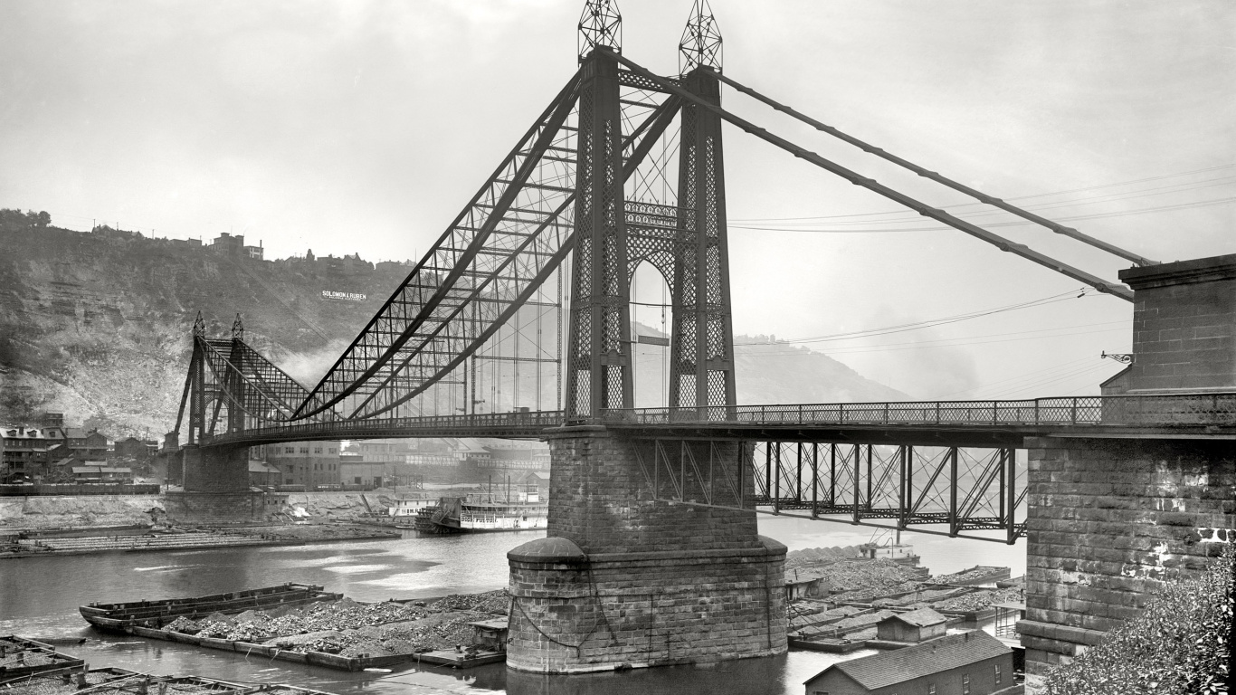 Grayscale Photo of Bridge Over River. Wallpaper in 1366x768 Resolution