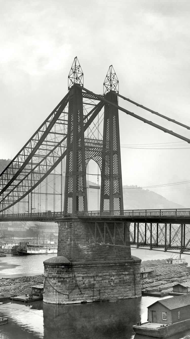 Grayscale Photo of Bridge Over River. Wallpaper in 750x1334 Resolution