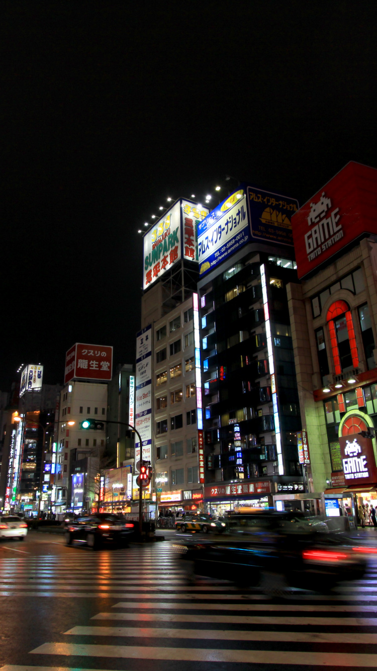 Cars on Road Near Buildings During Night Time. Wallpaper in 750x1334 Resolution