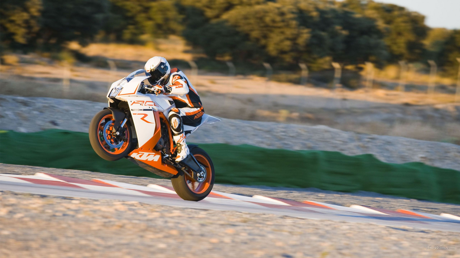 Man Riding Orange Dirt Bike on Road During Daytime. Wallpaper in 1920x1080 Resolution