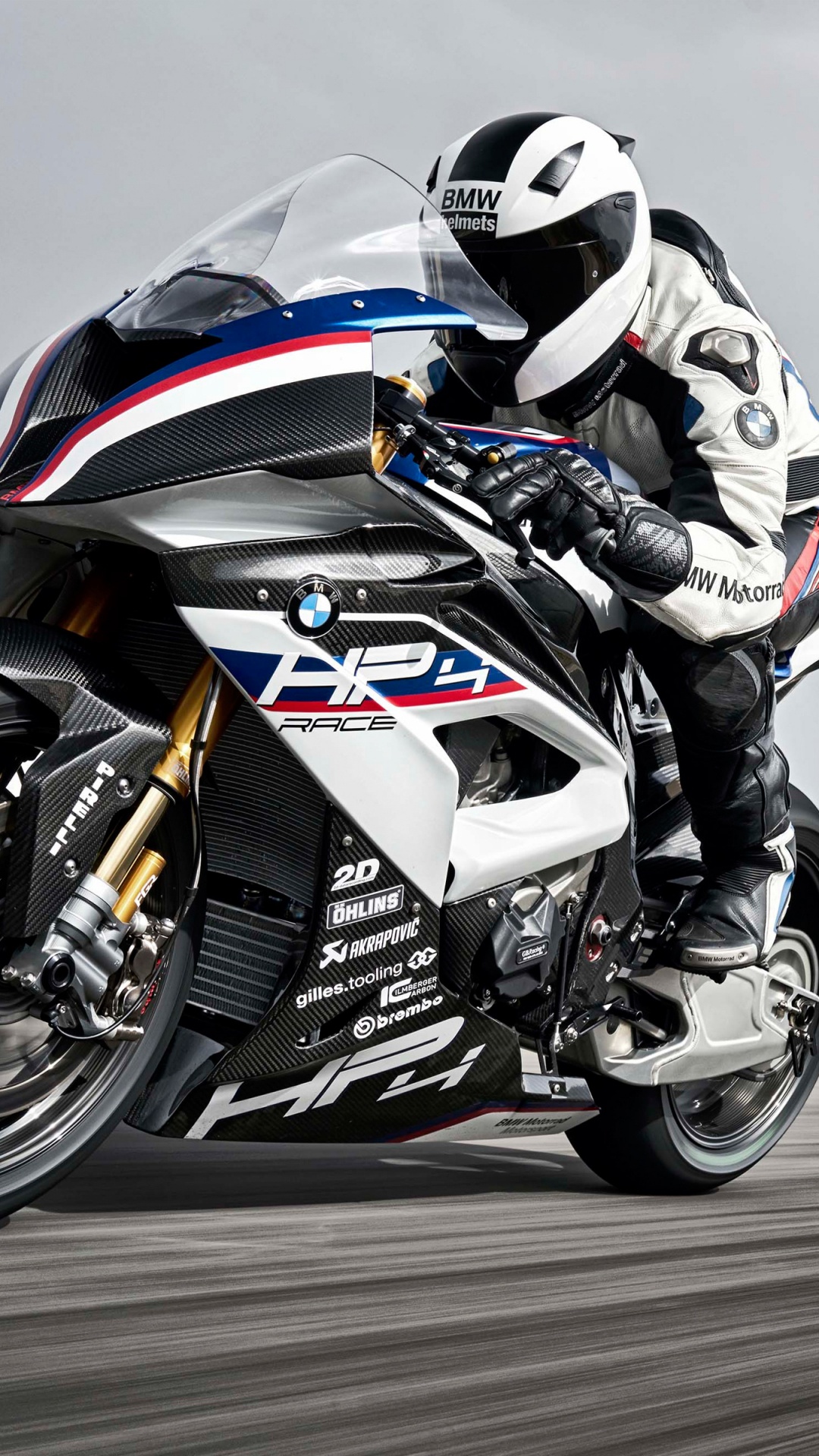 Man in Black and White Motorcycle Suit Riding on Black and White Sports Bike. Wallpaper in 1080x1920 Resolution