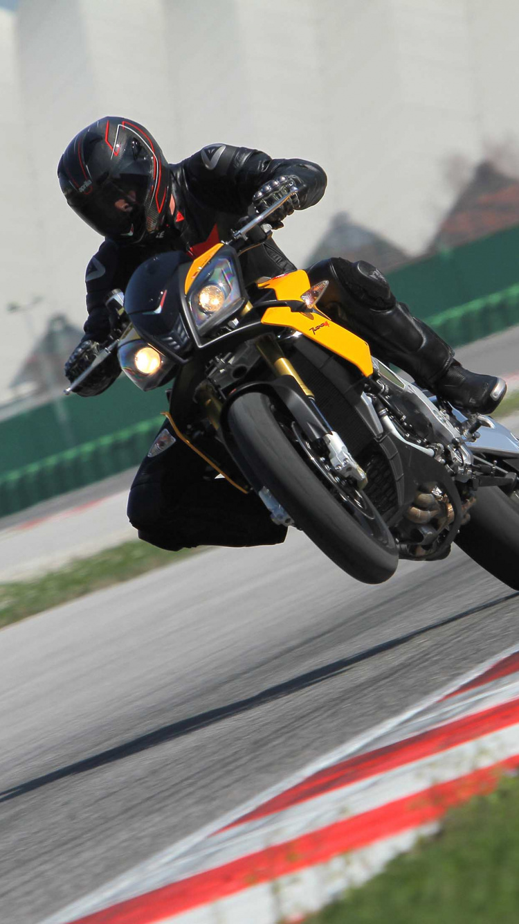Man in Yellow and Black Jacket Riding Yellow Sports Bike on Track Field During Daytime. Wallpaper in 750x1334 Resolution