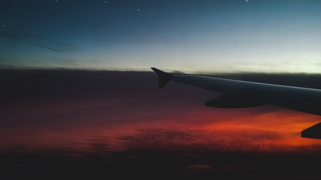 Airplane Wing Over The Clouds During Sunset. Wallpaper in 1366x768 Resolution