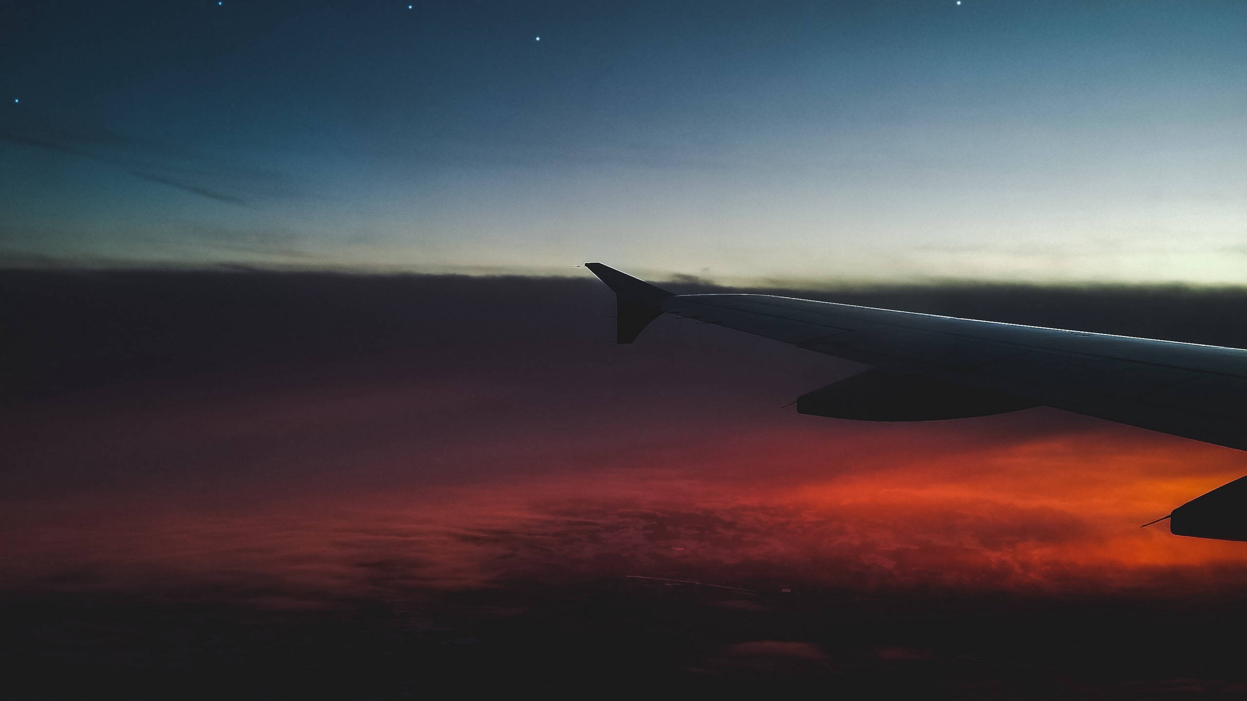 Airplane Wing Over The Clouds During Sunset. Wallpaper in 2560x1440 Resolution