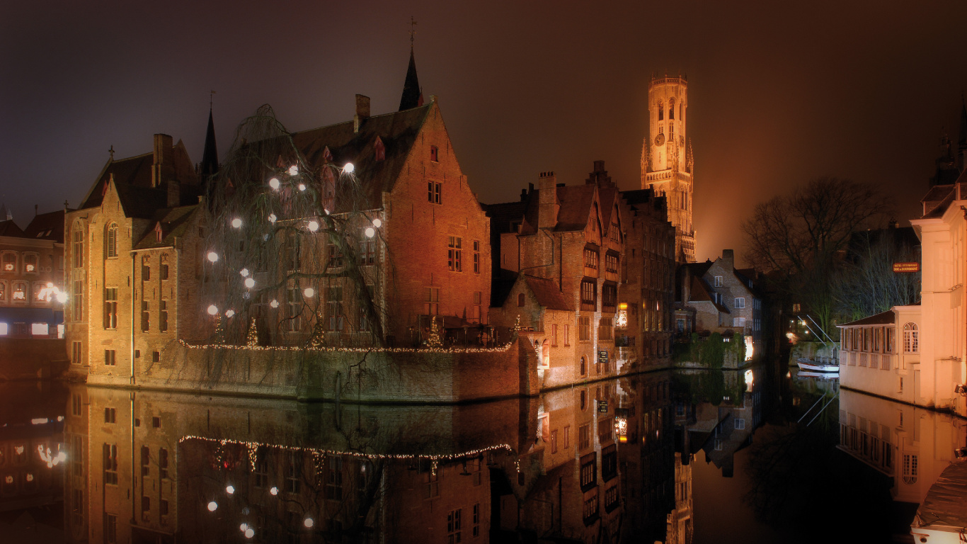 Brown Concrete Building During Night Time. Wallpaper in 1366x768 Resolution