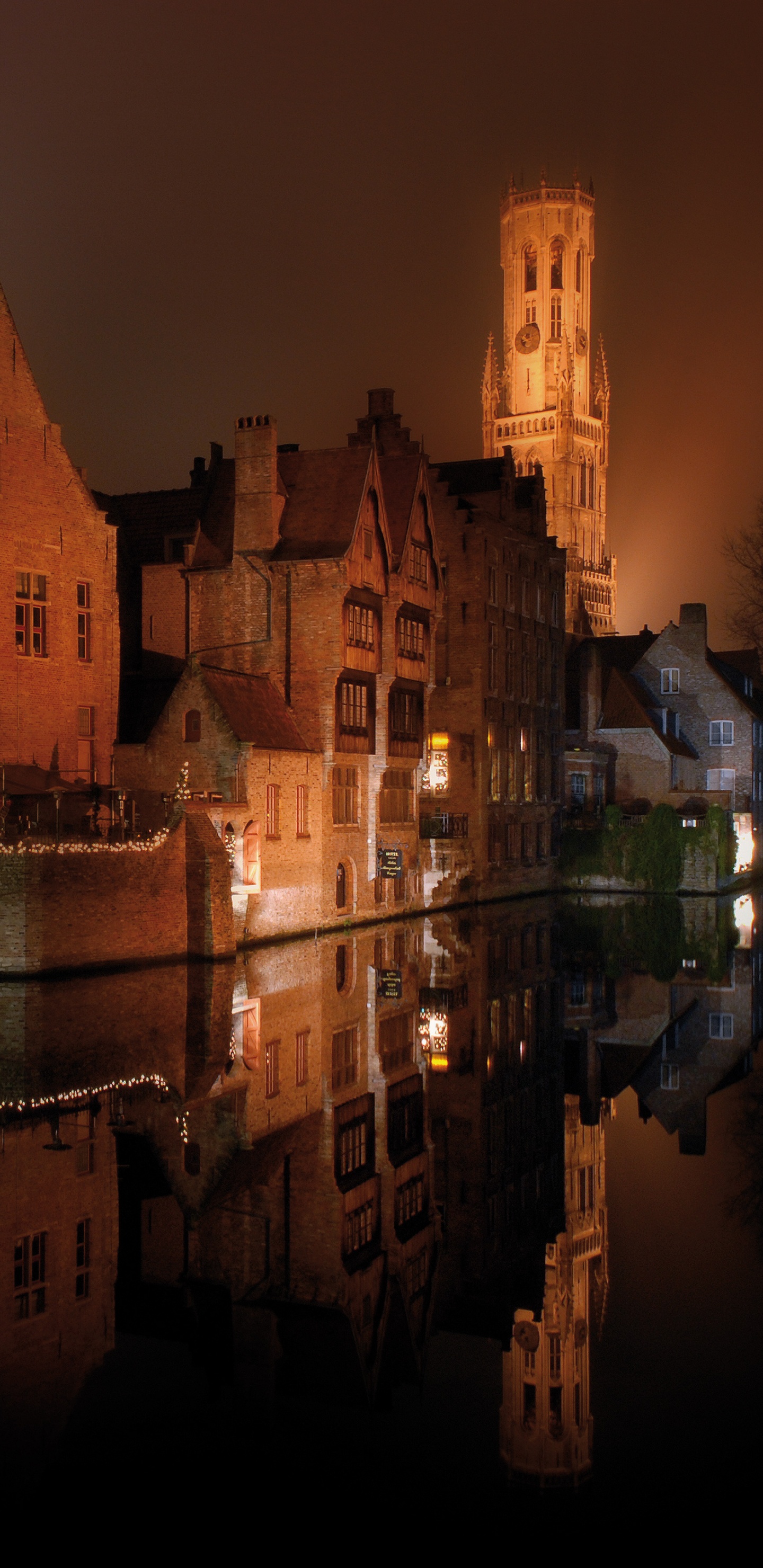 Brown Concrete Building During Night Time. Wallpaper in 1440x2960 Resolution