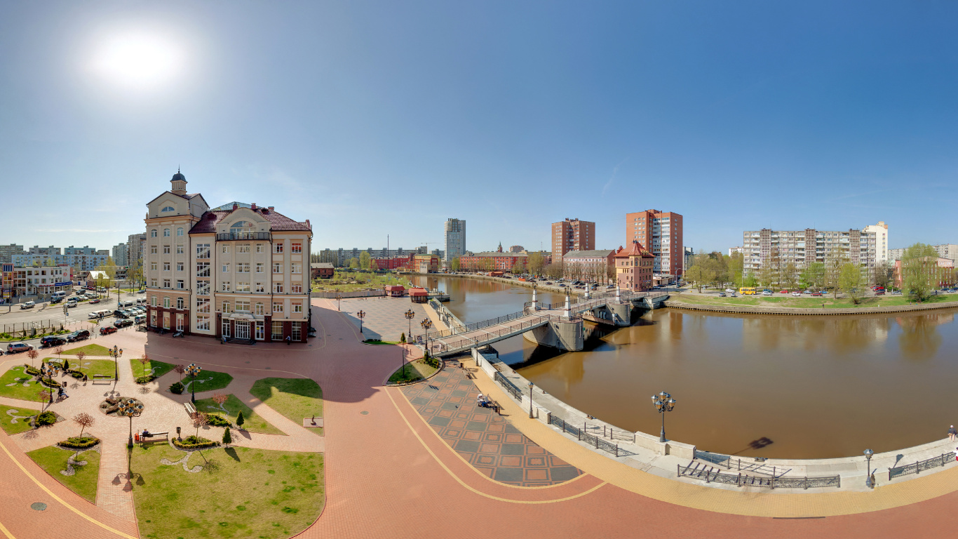 White and Brown Concrete Building Near Body of Water During Daytime. Wallpaper in 1366x768 Resolution