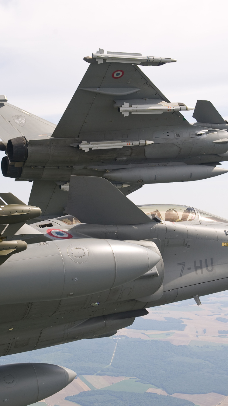 Gray Fighter Jet Flying Over Blue Sky During Daytime. Wallpaper in 750x1334 Resolution