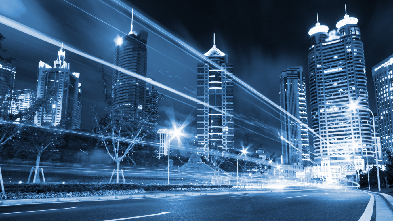 Edificios de la Ciudad Con Luces Encendidas Durante la Noche. Wallpaper in 1366x768 Resolution