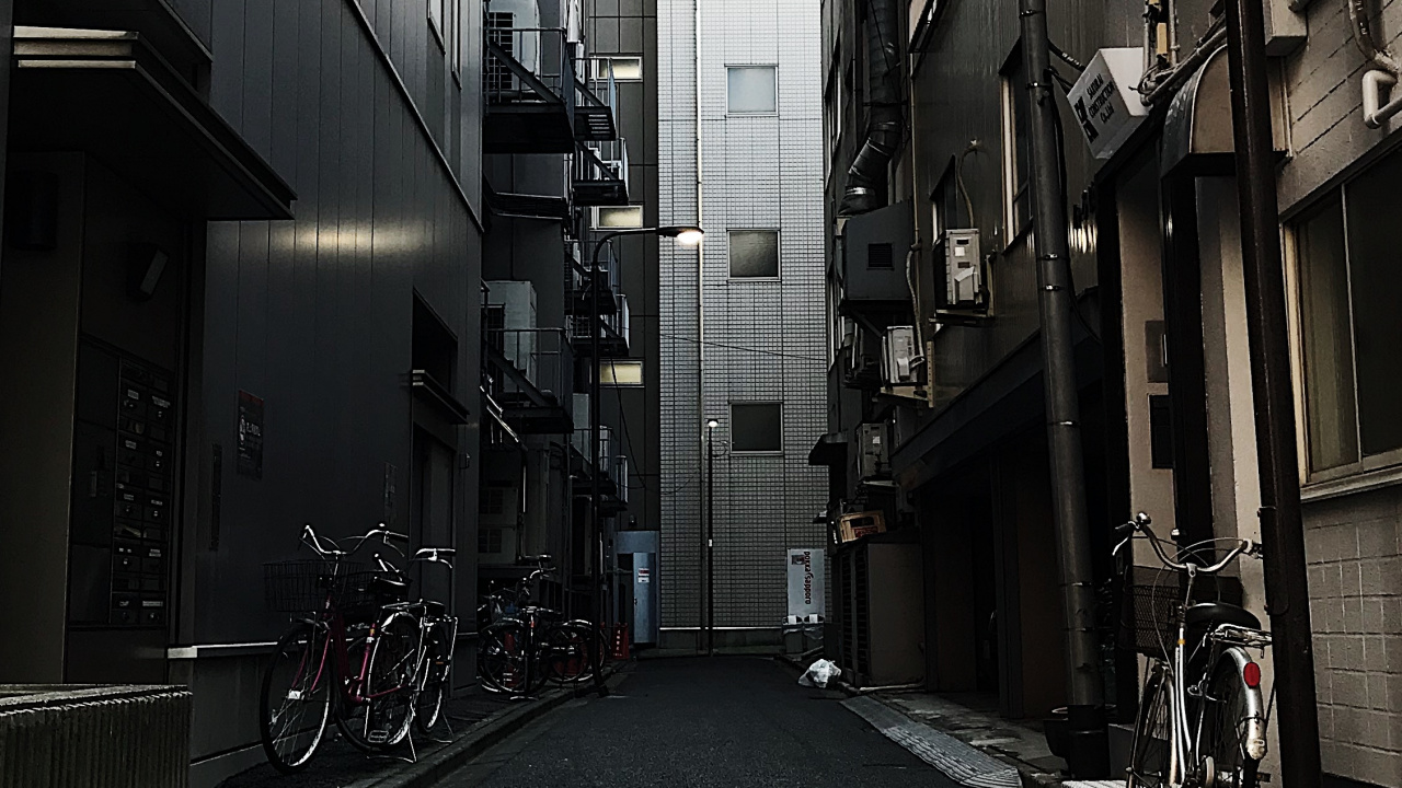 Black Bicycle Parked on Sidewalk During Daytime. Wallpaper in 1280x720 Resolution