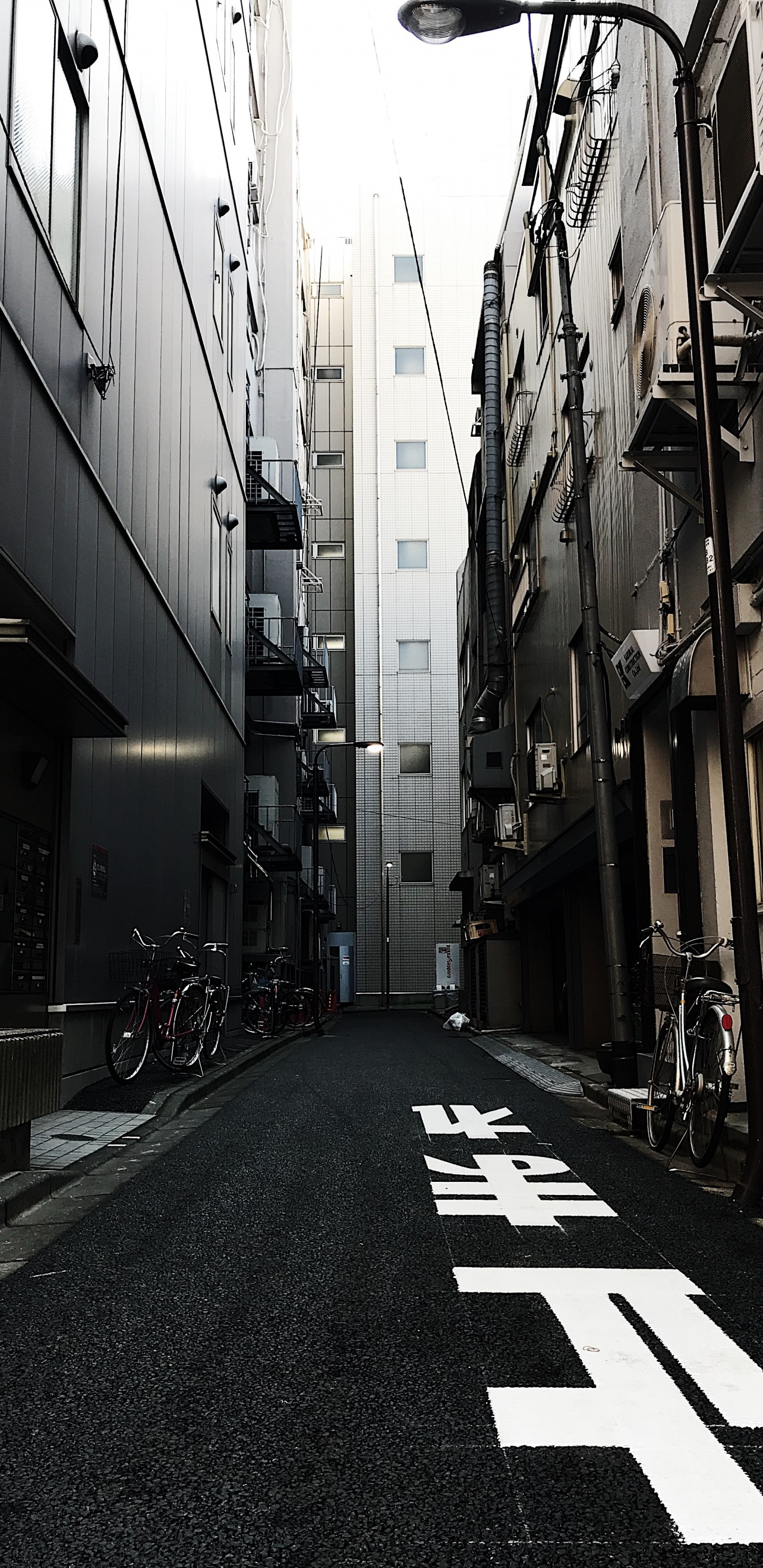 Black Bicycle Parked on Sidewalk During Daytime. Wallpaper in 1440x2960 Resolution