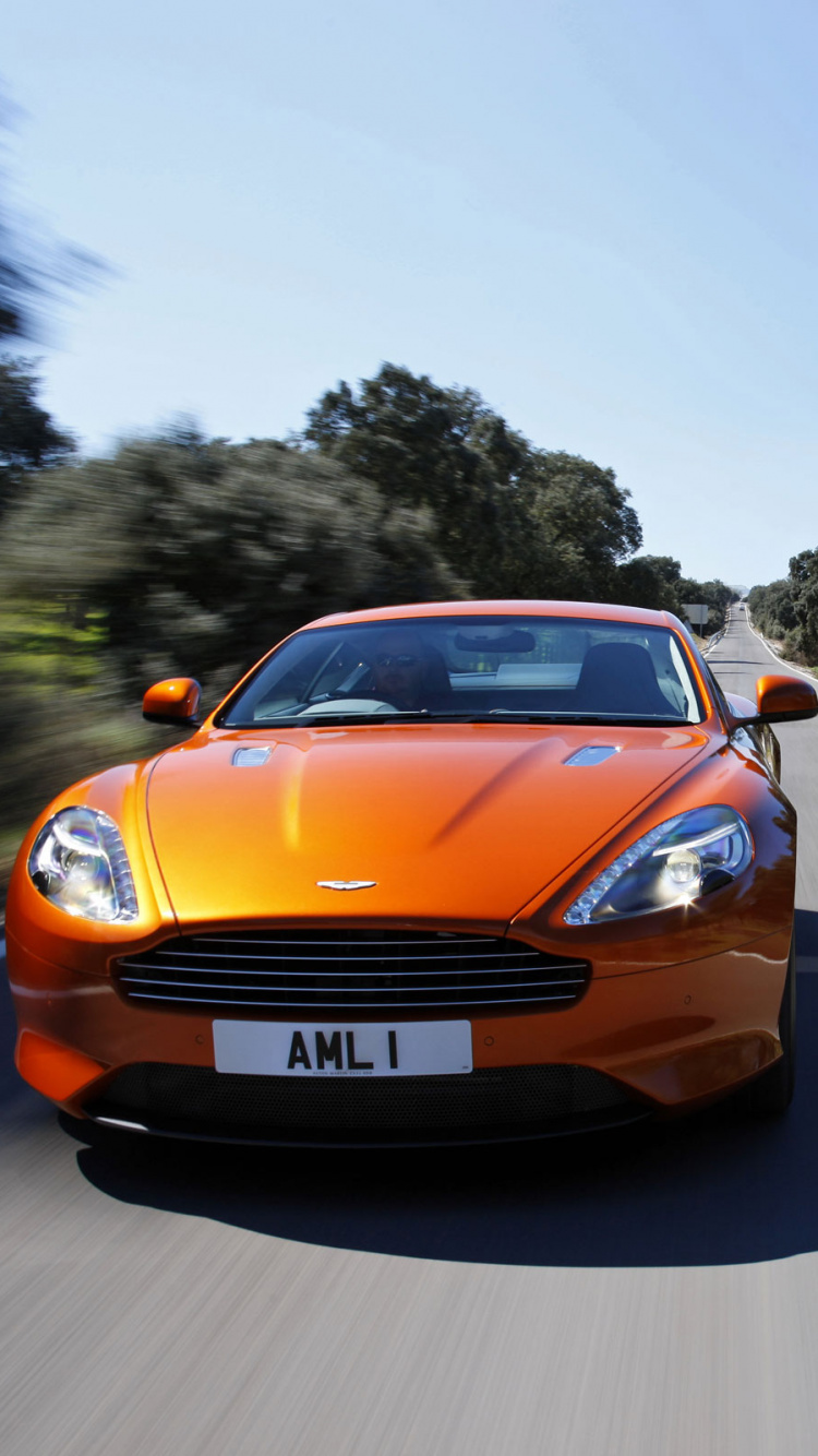 Oranger Porsche 911 Tagsüber Unterwegs. Wallpaper in 750x1334 Resolution