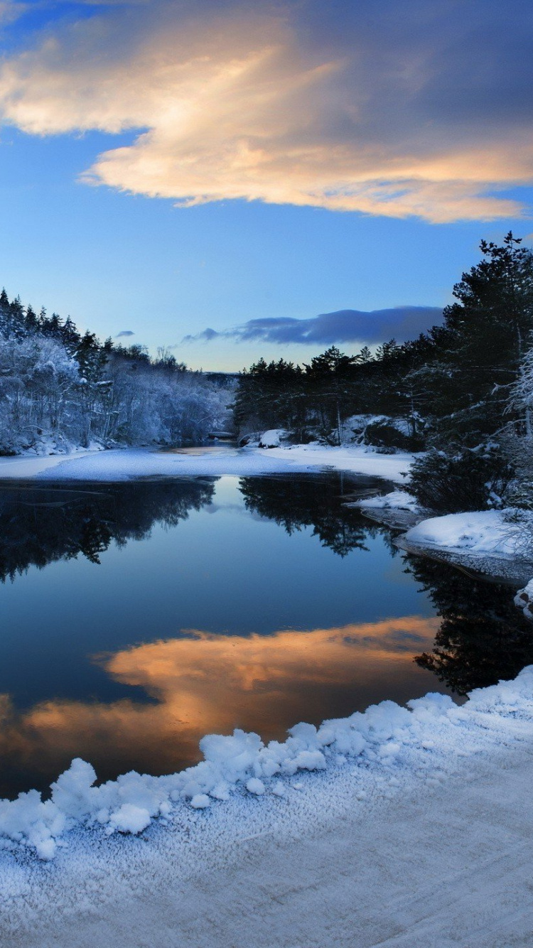 Snow Covered Mountain Near Lake Under Blue Sky During Daytime. Wallpaper in 750x1334 Resolution
