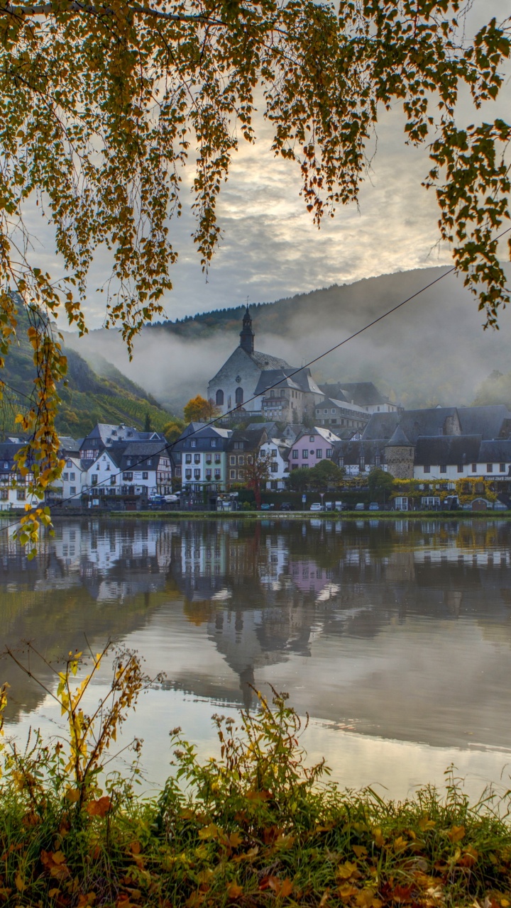 Body of Water Near Trees and Building During Daytime. Wallpaper in 720x1280 Resolution