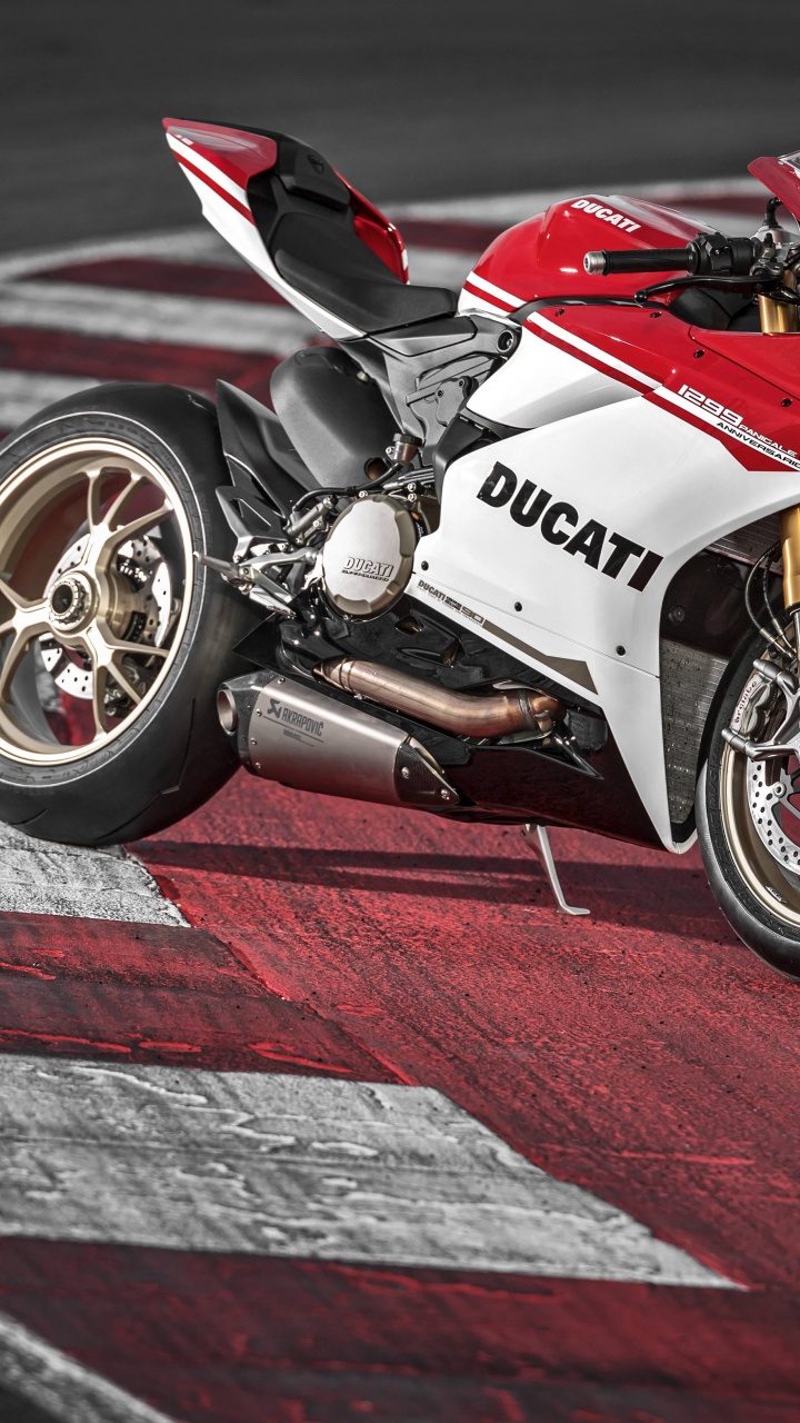 Red and White Sports Bike on Track Field. Wallpaper in 720x1280 Resolution