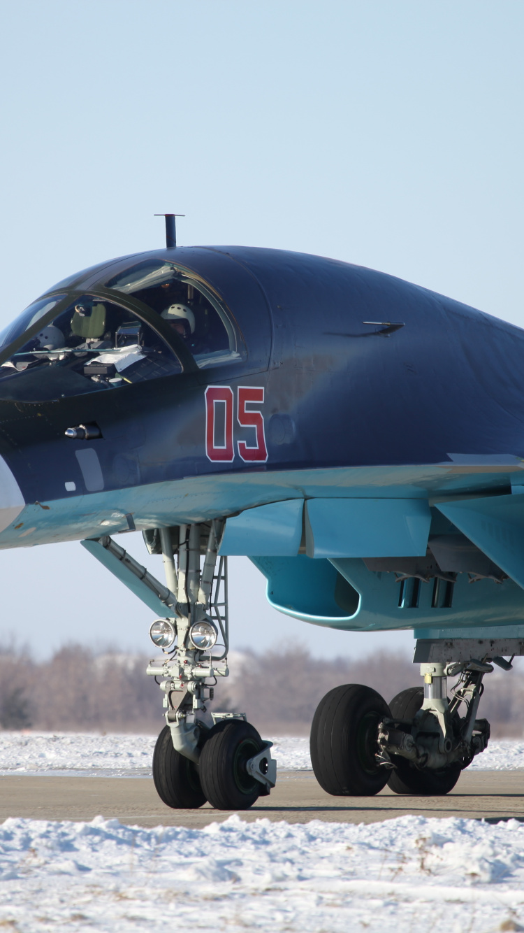 Avión Jet Negro Sobre Arena Gris Durante el Día. Wallpaper in 750x1334 Resolution