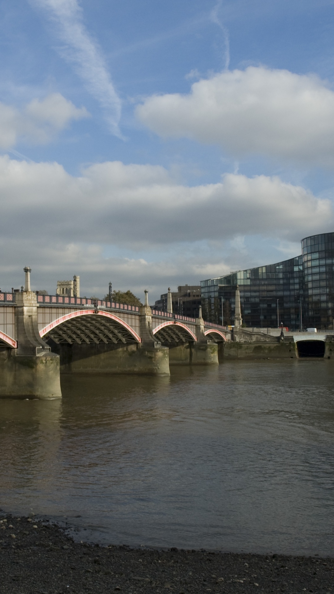 White Bridge Over Water Near City Buildings During Daytime. Wallpaper in 1080x1920 Resolution