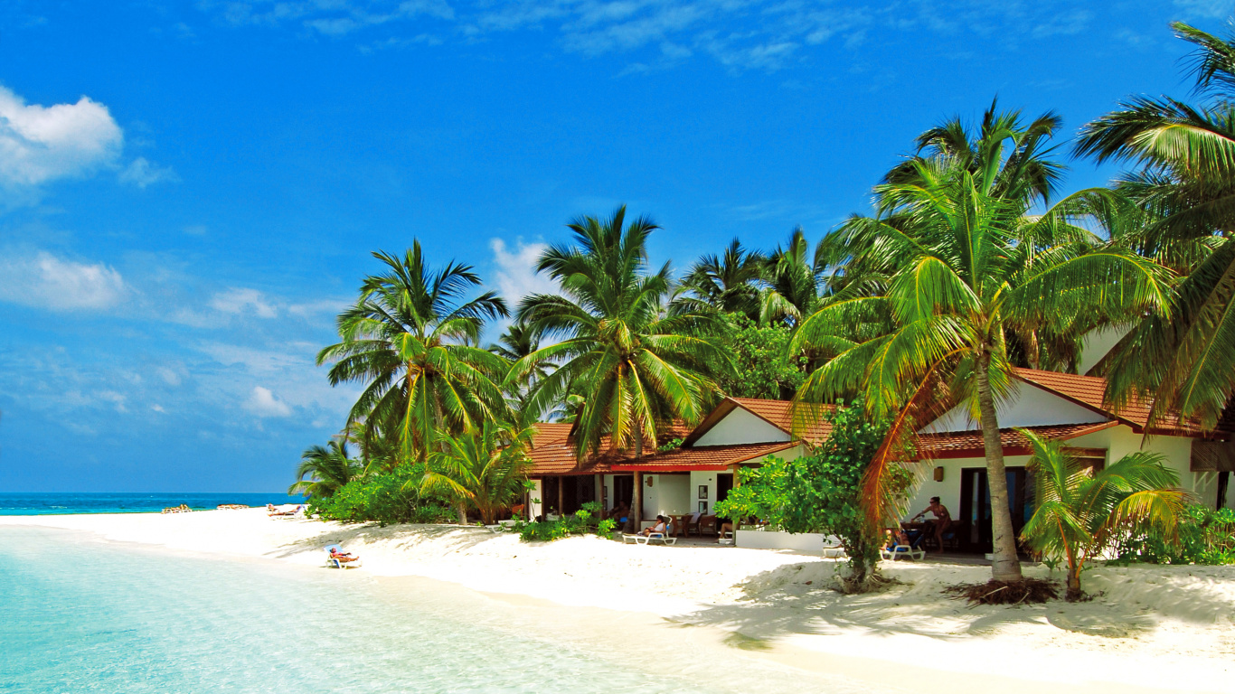 Brown Wooden Beach Lounge Chairs on White Sand Beach During Daytime. Wallpaper in 1366x768 Resolution