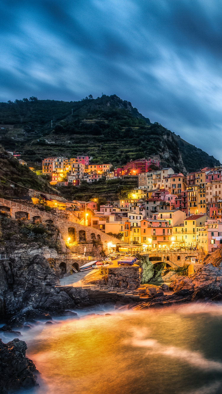 Brown and Green Mountain Beside Body of Water Under Cloudy Sky During Daytime. Wallpaper in 750x1334 Resolution