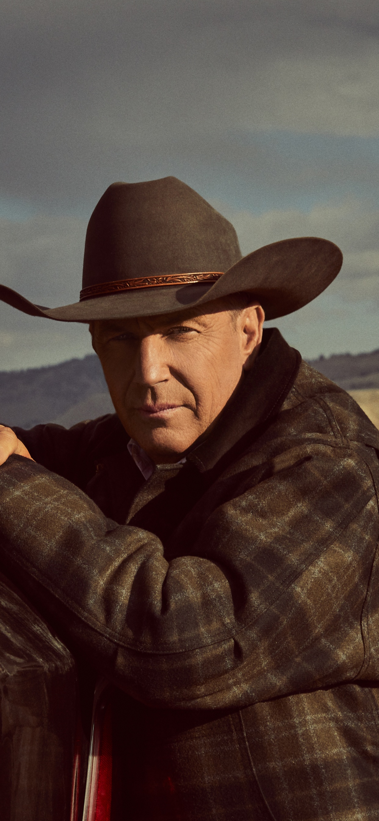 Man in Brown Cowboy Hat and Plaid Dress Shirt Sitting on Brown Wooden Bench. Wallpaper in 1242x2688 Resolution