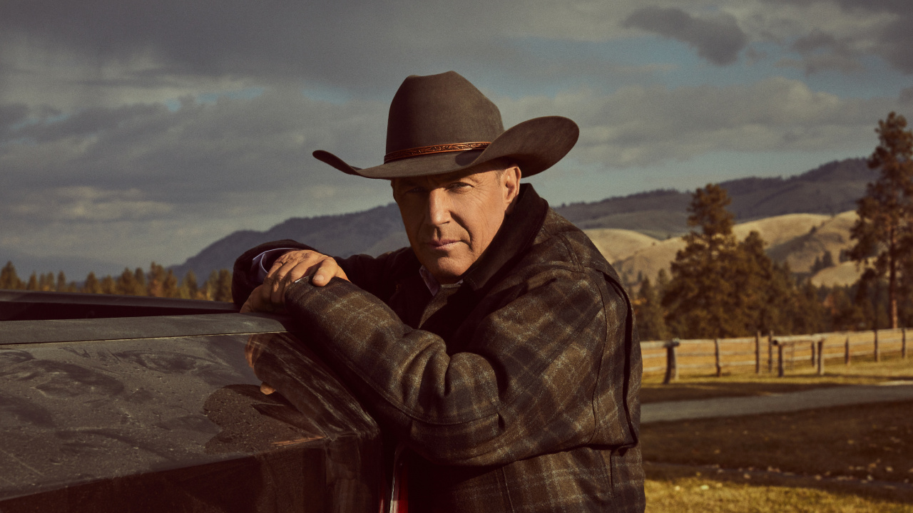 Man in Brown Cowboy Hat and Plaid Dress Shirt Sitting on Brown Wooden Bench. Wallpaper in 1280x720 Resolution