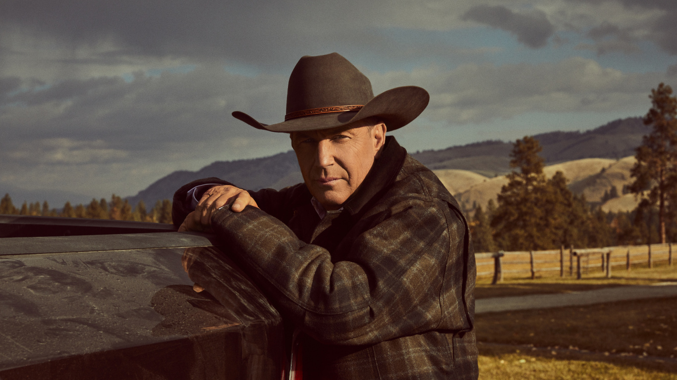 Man in Brown Cowboy Hat and Plaid Dress Shirt Sitting on Brown Wooden Bench. Wallpaper in 1366x768 Resolution