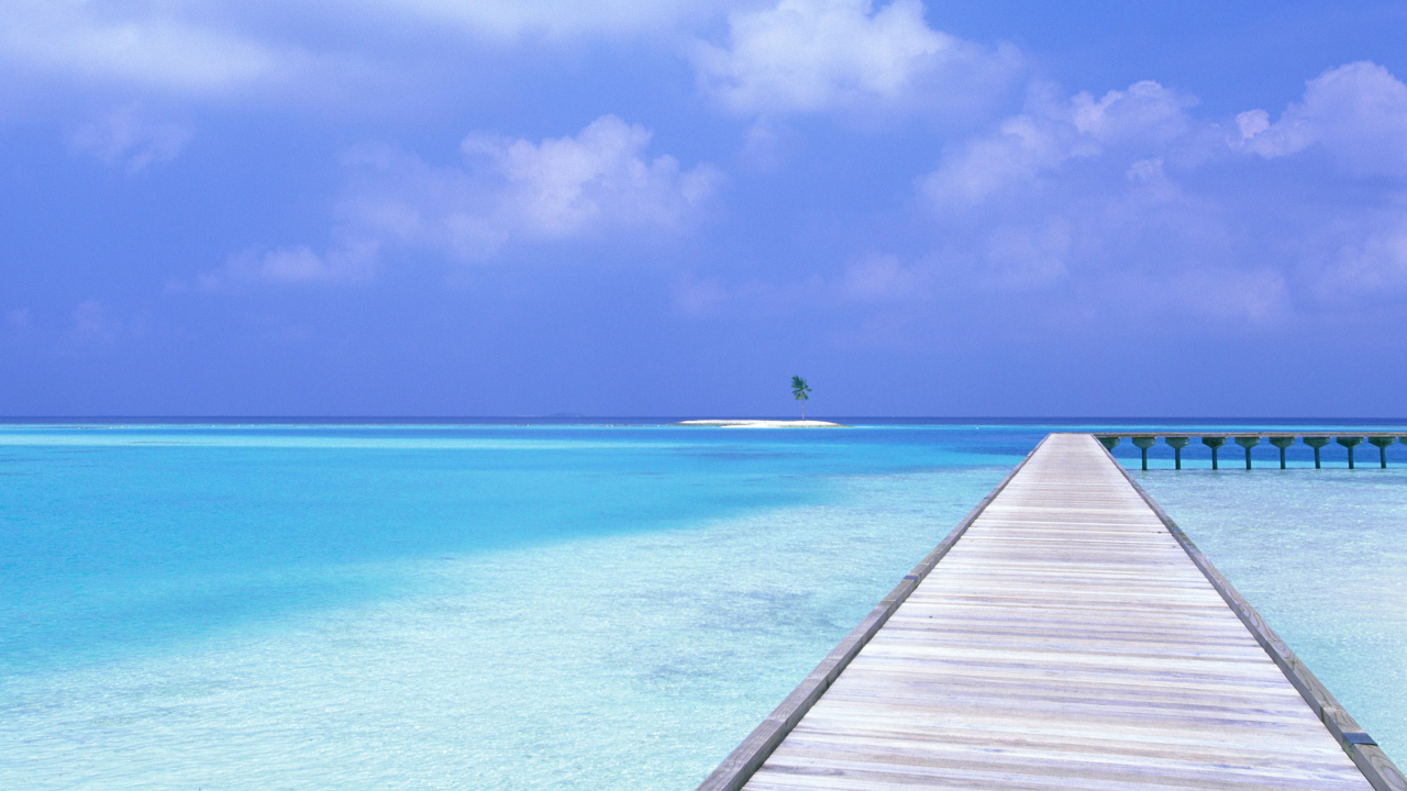 Brown Wooden Dock on Blue Sea Under Blue Sky During Daytime. Wallpaper in 1280x720 Resolution
