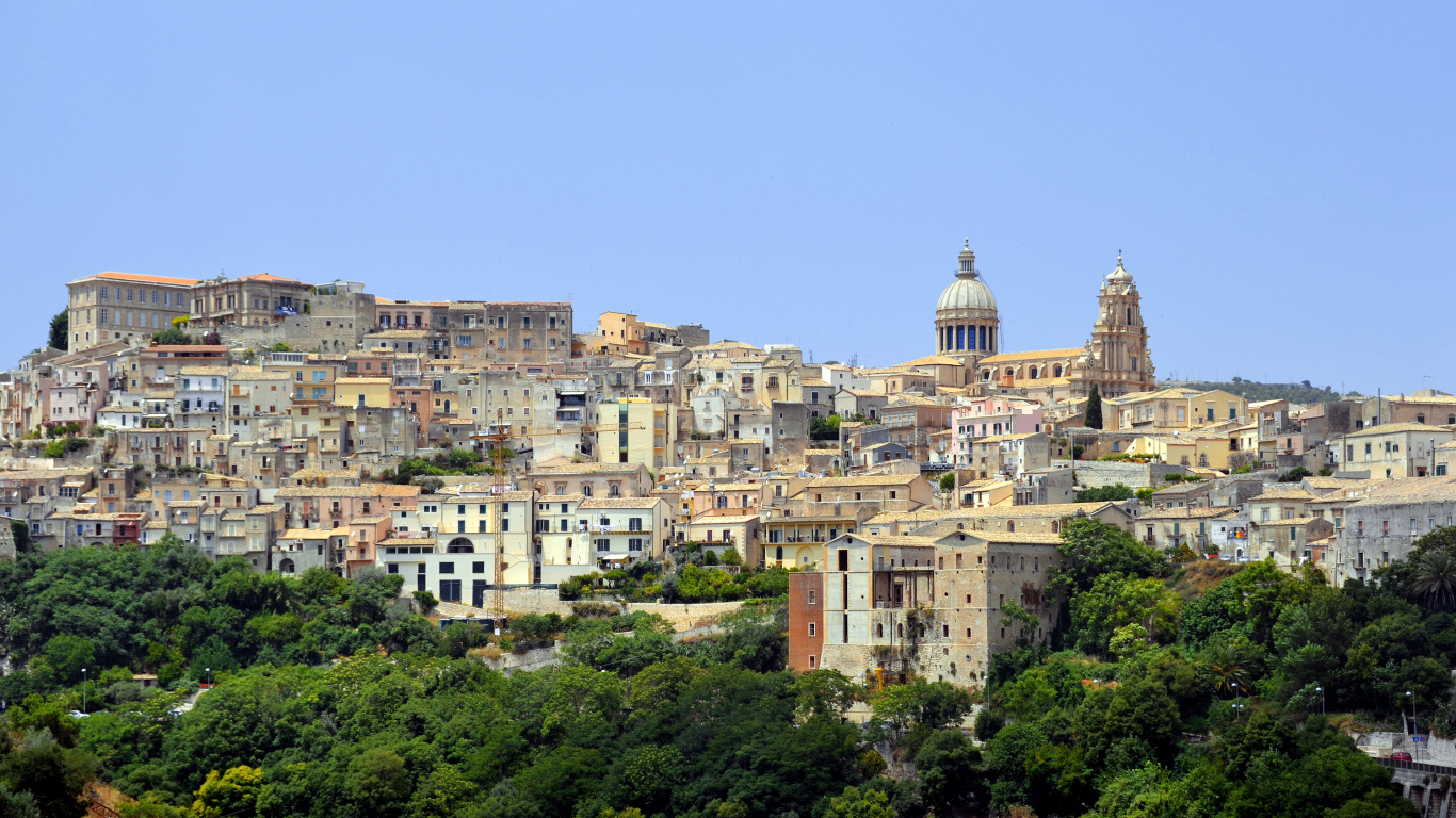 Brown and White Concrete Buildings on Mountain. Wallpaper in 1366x768 Resolution