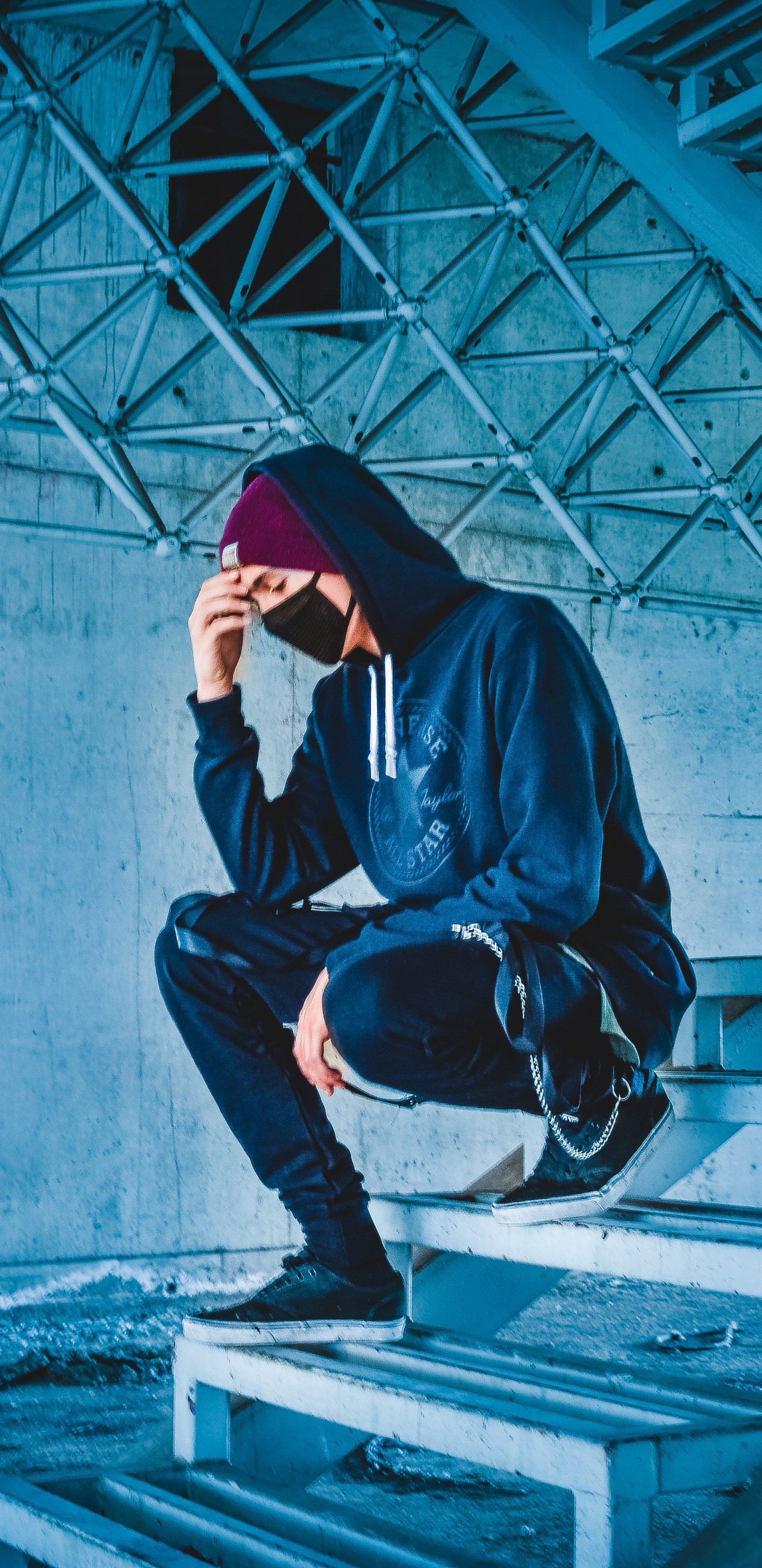 Man in Black Hoodie and Black Pants Sitting on Concrete Stairs. Wallpaper in 1440x2960 Resolution