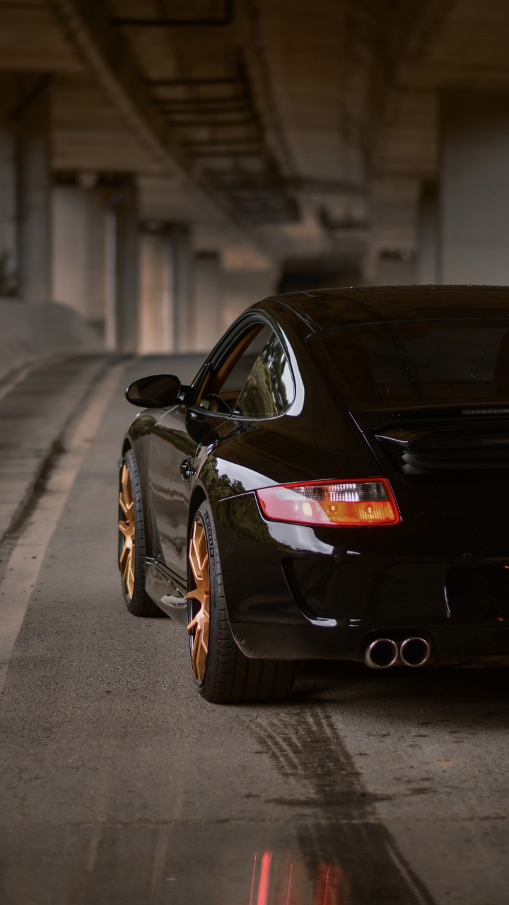 Schwarzer Porsche 911 Tagsüber Auf Bürgersteig Geparkt. Wallpaper in 720x1280 Resolution