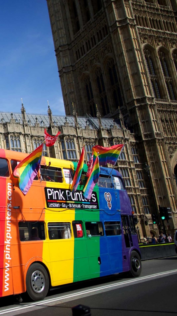 Red and Yellow Bus on Road Near Building During Daytime. Wallpaper in 720x1280 Resolution