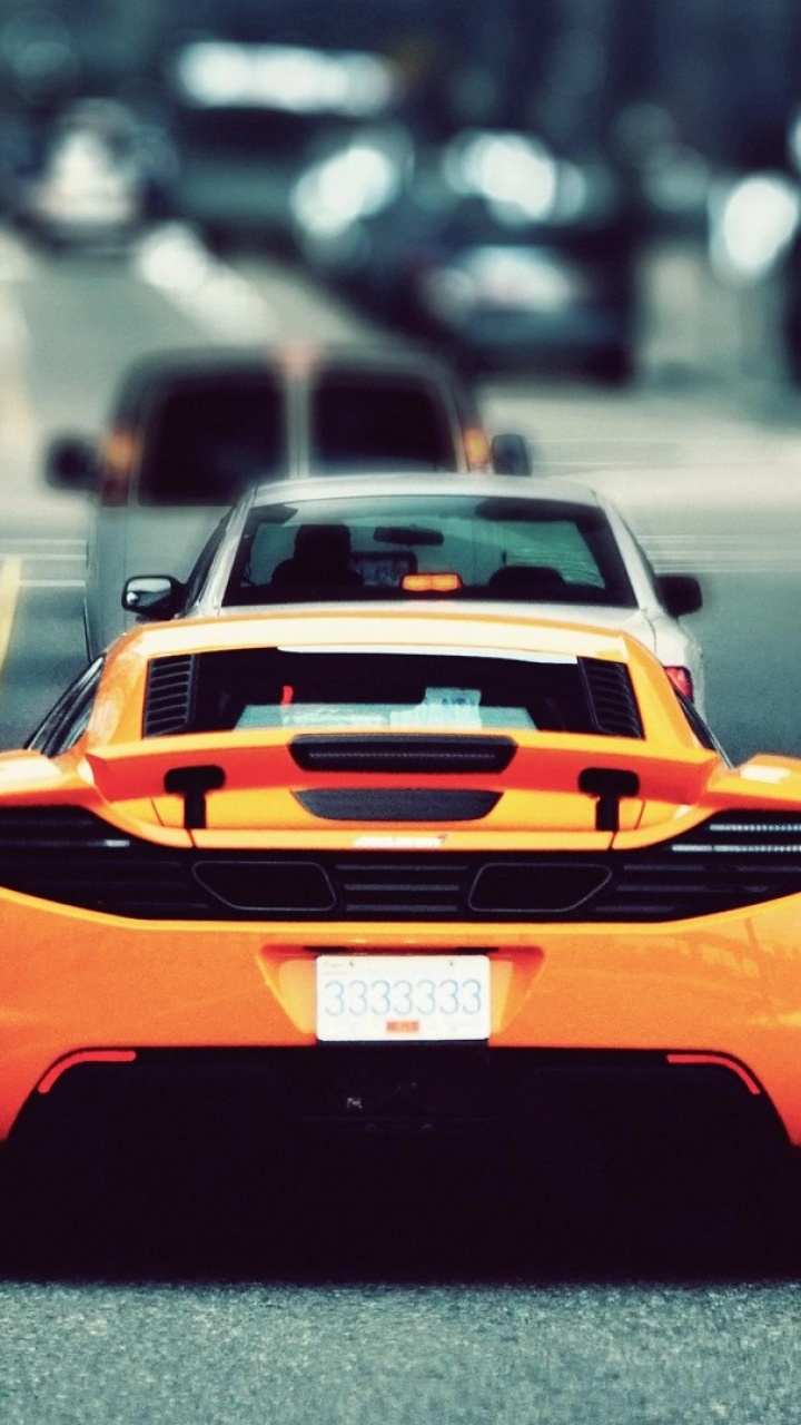 Lamborghini Aventador Naranja en la Carretera Durante el Día. Wallpaper in 720x1280 Resolution