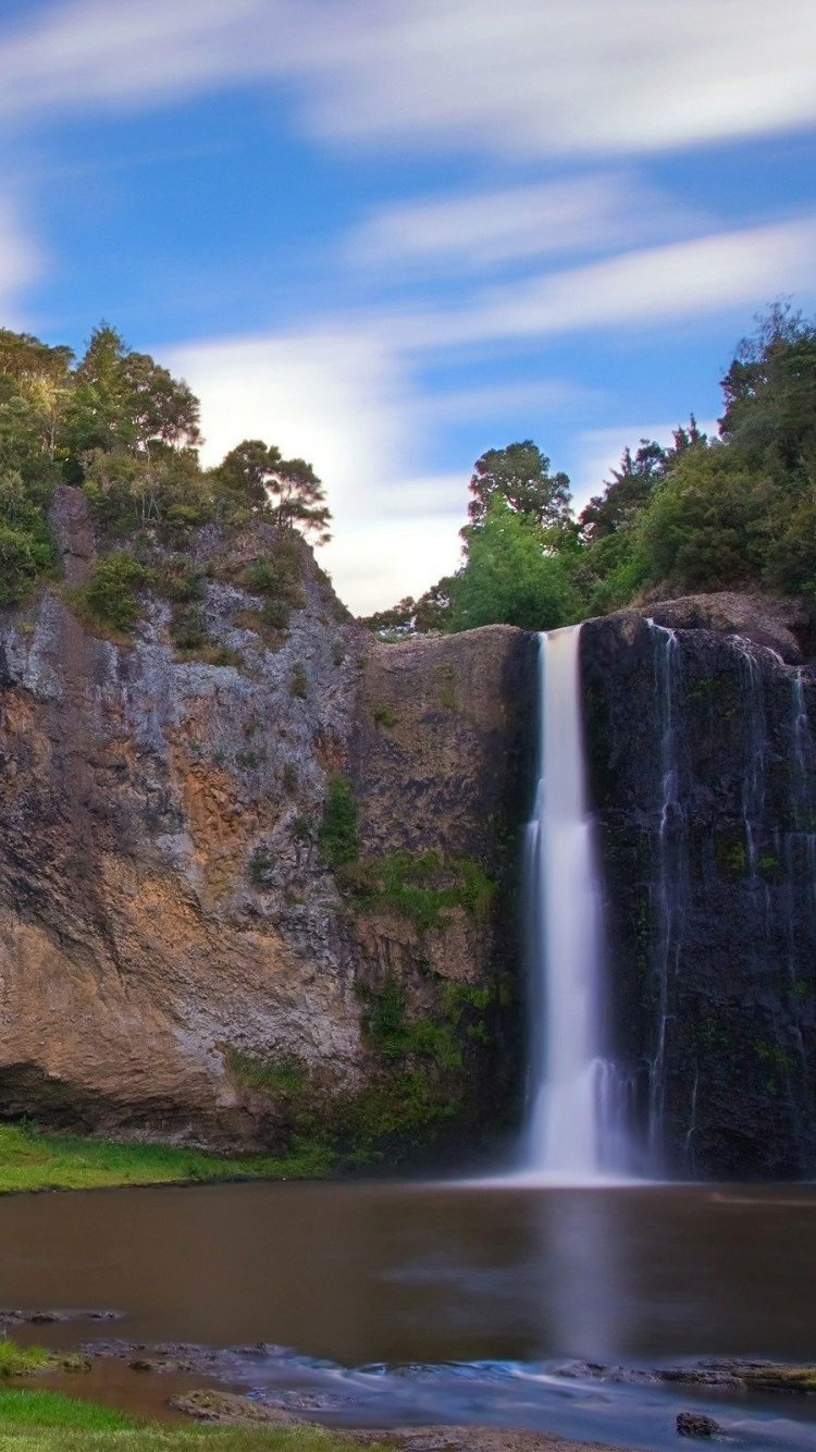 Waterfalls Near Green Trees Under Blue Sky During Daytime. Wallpaper in 750x1334 Resolution