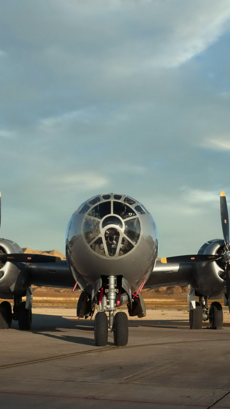 Black Jet Plane on Brown Wooden Dock Under White Clouds During Daytime. Wallpaper in 750x1334 Resolution