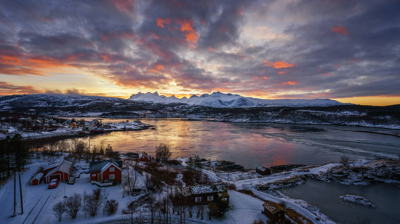 Snow Covered Field Near Body of Water Under Cloudy Sky During Daytime. Wallpaper in 1366x768 Resolution