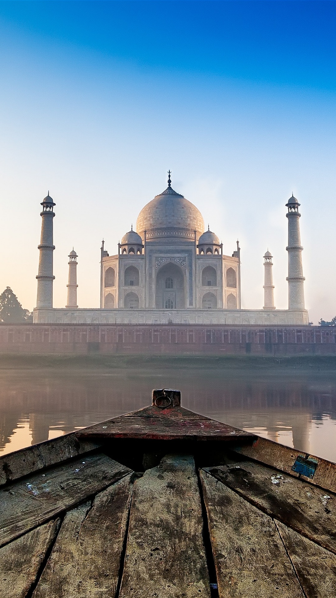 White Concrete Building Near Body of Water During Daytime. Wallpaper in 1080x1920 Resolution
