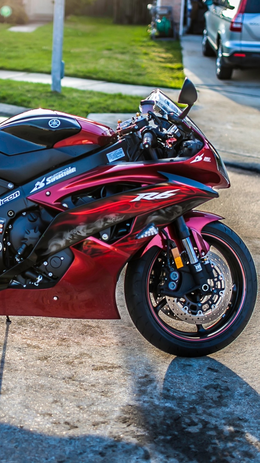 Red and Black Sports Bike Parked on Gray Concrete Pavement During Daytime. Wallpaper in 1080x1920 Resolution
