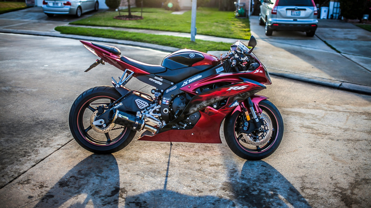 Red and Black Sports Bike Parked on Gray Concrete Pavement During Daytime. Wallpaper in 1280x720 Resolution