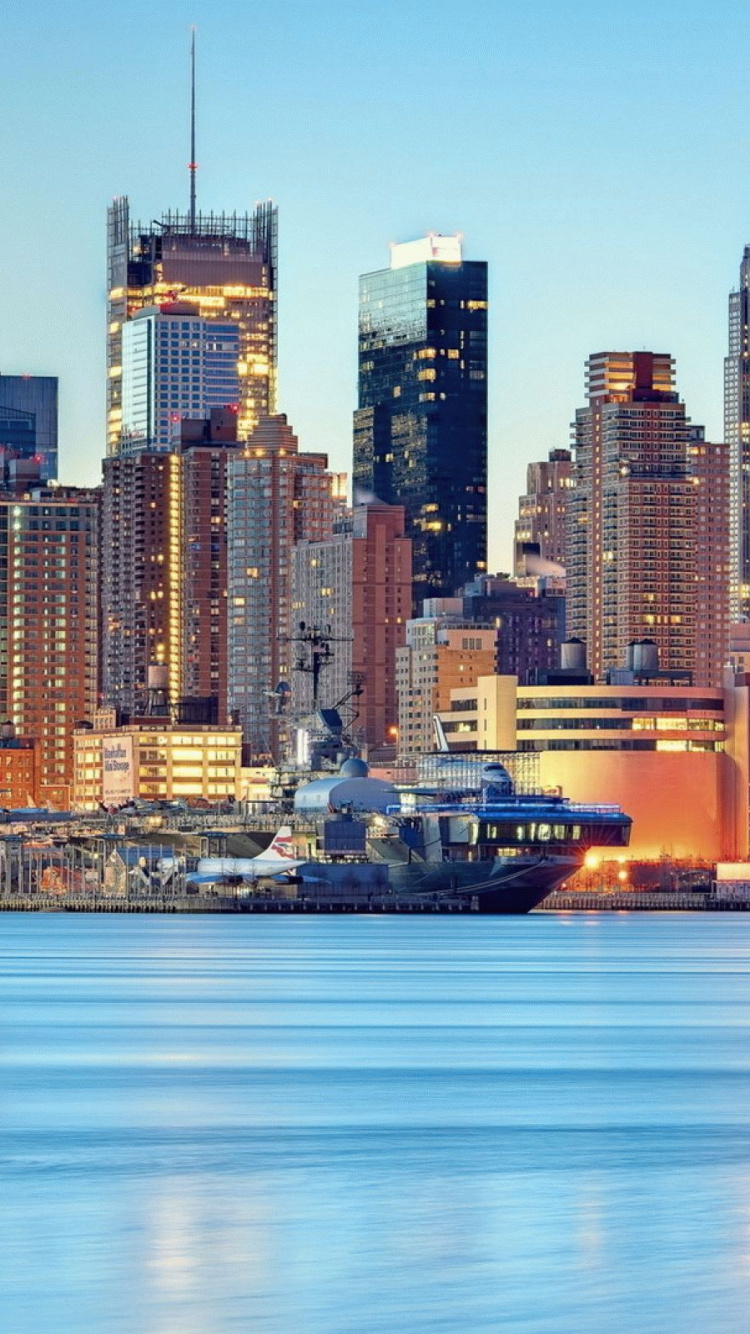 City Skyline Across Body of Water During Daytime. Wallpaper in 750x1334 Resolution